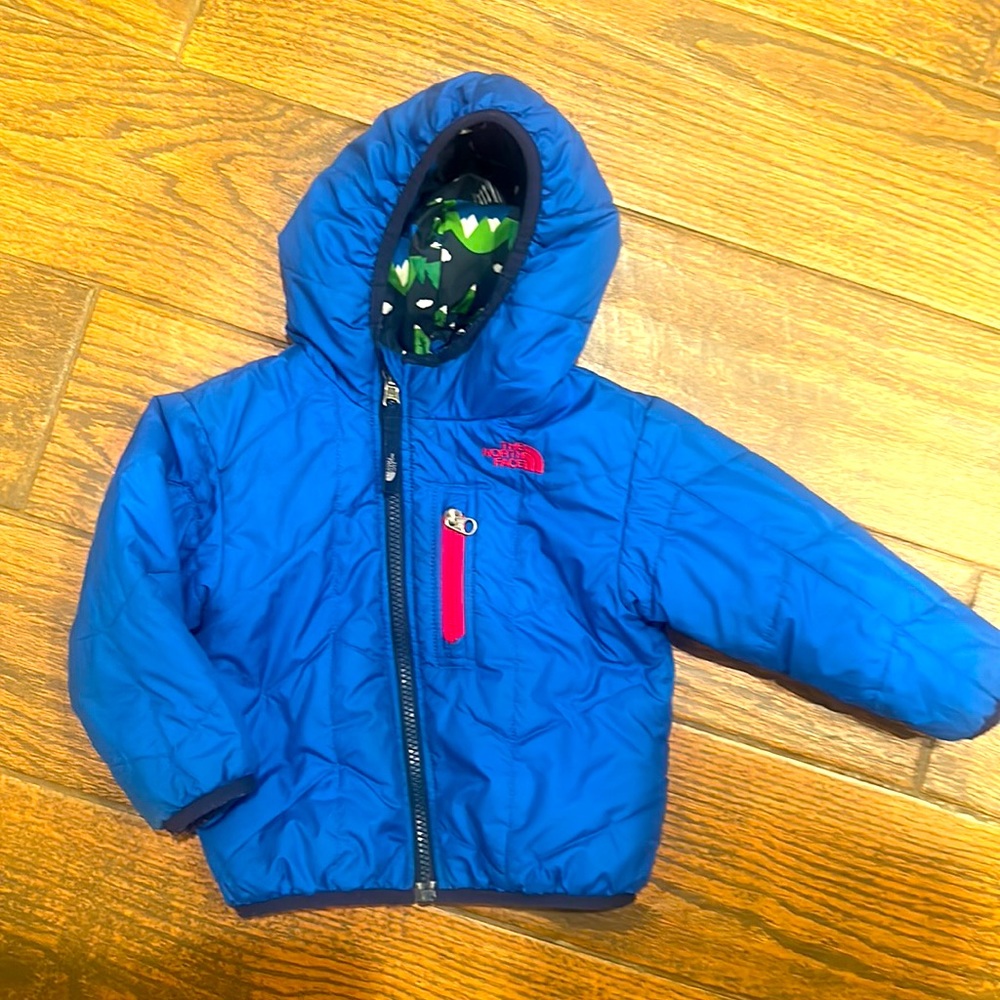 The North Face reversible winter puffer jacket with zipper pocket detail
